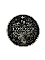 Side angle of the Heart of Jesus Cuffs in sterling silver, highlighting the high-relief sculpture and radiant background.