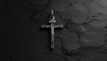 Side angle view of INRI Crucifix Pendant 925 silver cross featuring three-dimensional Jesus figure and textured wood design
