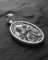 Side angle view of Saint Christopher Medal Pendant sterling silver pendant displaying dimensional relief of saint crossing river with Jesus