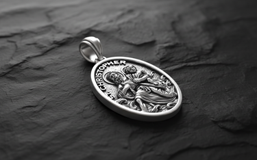 Side angle view of Saint Christopher Medal Pendant sterling silver pendant displaying dimensional relief of saint crossing river with Jesus