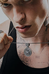 Side angle view of the Sterling Silver Divine Protection Pendant, showing the Guardian Angel and Jesus Prayer inscription.