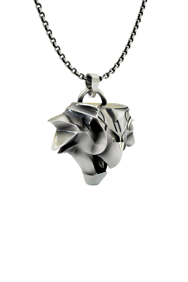 Side angle view of the Sterling Silver Griffin School Pendant, highlighting the complex, angular planes of the design.