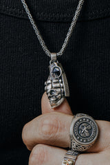 Side angle view of the Sterling Silver Skull Grenade Pendant, highlighting the 3D skull and grenade details.
