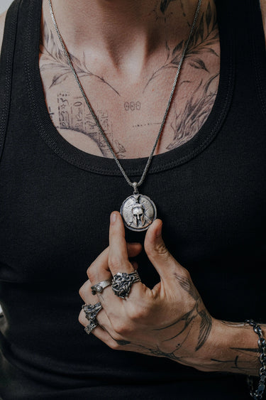 Side angle view of the Sterling Silver Spartan Warrior Pendant, highlighting the 3D relief and cracked texture.