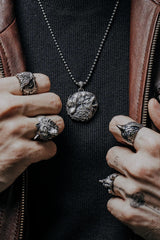 Side angle view of the Sterling Silver Witcher Wolf Medallion, highlighting the sharp, geometric design.