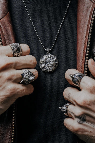 Side angle view of the Sterling Silver Witcher Wolf Medallion, highlighting the sharp, geometric design.