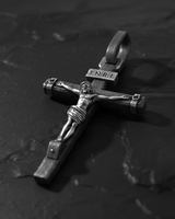 Side profile view of INRI Crucifix Pendant sterling silver cross displaying dimensional relief and corpus detail