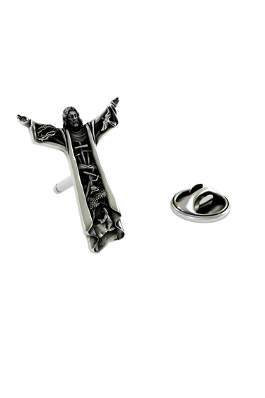 Silver Christ the Redeemer Lapel Pin in 925 sterling, front view showing the iconic pose with detailed scenes within the robes.
