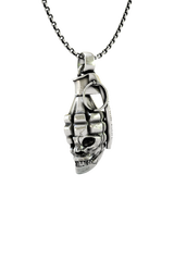 Skull Grenade Pendant shown on a model to demonstrate its size and powerful military aesthetic.