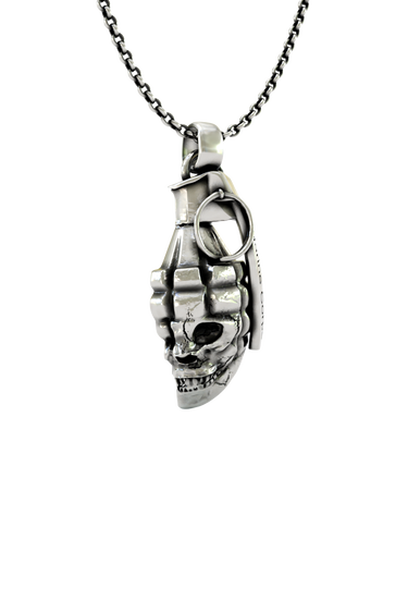 Skull Grenade Pendant shown on a model to demonstrate its size and powerful military aesthetic.