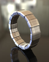3D render of a geometric silver ring showing the segmented construction and brushed metallic texture on a reflective surface.