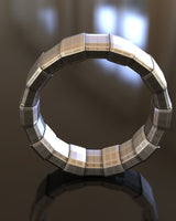 Top-down view of the handcrafted geometric silver ring highlighting its architectural beveled edges and durable build.