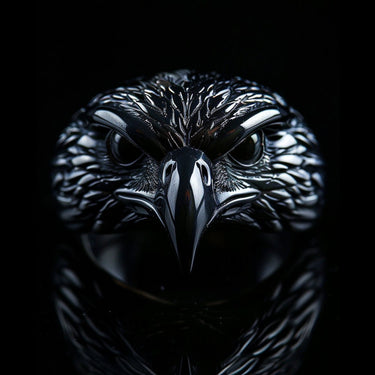 925 sterling silver eagle ring with detailed feathers and piercing eyes displayed on dark background