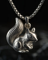 925 sterling silver squirrel pendant with detailed fur texture and bushy tail on black background