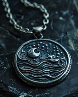 925 sterling silver celestial pendant with crescent moon stars and waves on dark textured background showing detail
