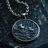 925 sterling silver celestial pendant with crescent moon stars and waves on dark textured background showing detail