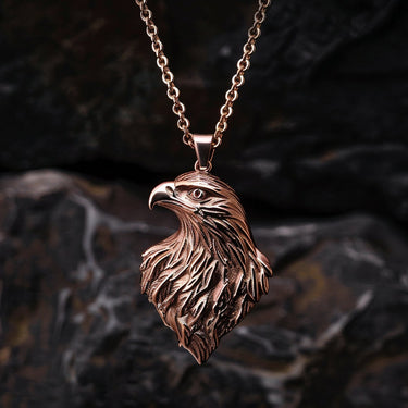 925 sterling silver eagle head pendant with rose gold plating showing detailed feather work against dark background
