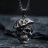 925 sterling silver skull beret pendant necklace displayed on dark textured surface with chain