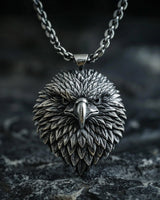 925 sterling silver eagle pendant with intricate feather details displayed on dark textured background