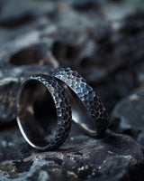 925 sterling silver hammered textured rings with honeycomb pattern displayed on dark stone surface background