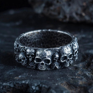 925 sterling silver skull wedding ring with intricate gothic design and oxidized finish on dark stone background
