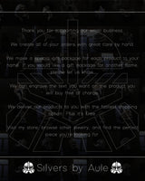 Various sterling silver jewelry pieces including hammered rings, oxidized pendants, and gold-plated accessories collection