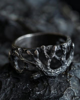 925 sterling silver tree branch ring with organic texture displayed on dark rocky surface showing natural design