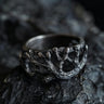 925 sterling silver tree branch ring with organic texture displayed on dark rocky surface showing natural design
