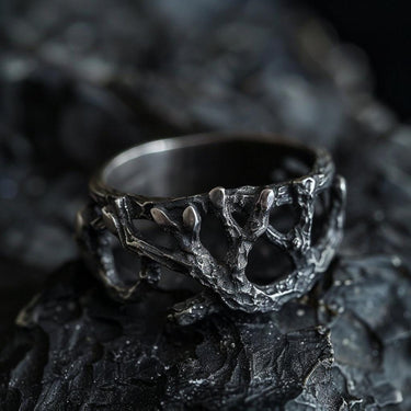 925 sterling silver tree branch ring with organic texture displayed on dark rocky surface showing natural design
