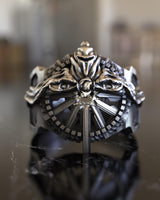 High-detail studio render of the Silver Ring of Lucii on a reflective marble surface, focusing on the polished finish.