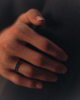 Handcrafted silver moon ring worn on a finger, demonstrating its scale, comfortable fit, and unique space-themed design.