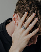 Gothic skull ring worn on hand showing detailed craftsmanship and oxidized sterling silver finish