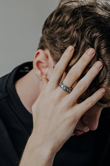 Gothic skull ring worn on hand showing detailed craftsmanship and oxidized sterling silver finish