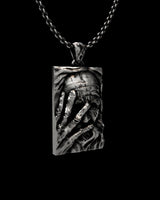 Angled view of the Silver Wisdom Pendant, highlighting the three-dimensional depth of the carved philosopher portrait.