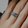 Silver Koi Fish Ring with detailed Japanese waves worn on a finger, showcasing the handcrafted oxidized finish and texture.