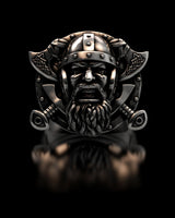 Front view of the silver Viking Warrior ring showcasing the detailed berserker face and crossed axes on a black background.