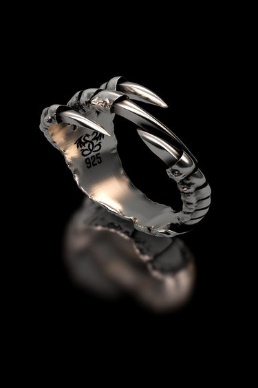 Studio product shot of the Dragon Claw Ring in 925 sterling silver on a black background, highlighting the polished claws.