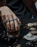 Close-up detail of the men's Silver Koi Fish Ring, emphasizing the intricate scales and swirling sterling silver ocean waves.