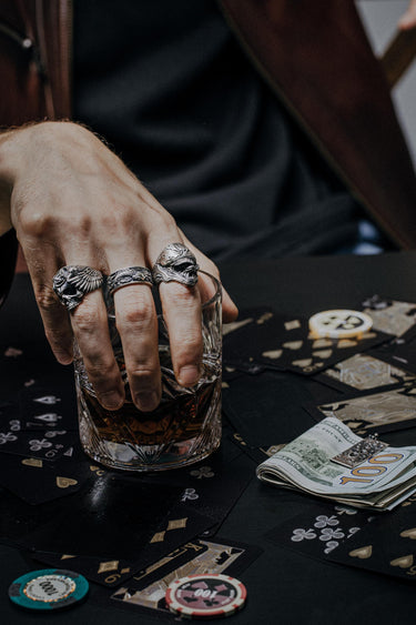 Close-up detail of the men's Silver Koi Fish Ring, emphasizing the intricate scales and swirling sterling silver ocean waves.