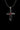 Angled view of the sterling silver infinity cross pendant, highlighting the polished finish and the setting of the red gems.