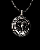 Close-up view of handcrafted Aries zodiac pendant showing oxidized finish and intricate ram skull details