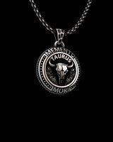 Men's Taurus Zodiac Necklace in 925 sterling silver. Angled view highlighting the 3D relief of the bull skull and oxidized details.