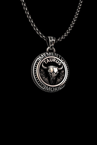 Men's Taurus Zodiac Necklace in 925 sterling silver. Angled view highlighting the 3D relief of the bull skull and oxidized details.