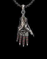 925 sterling silver mystic hand pendant with red crystal stones displayed on black background