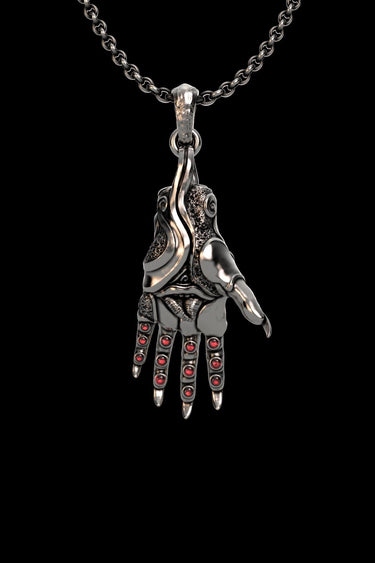 925 sterling silver mystic hand pendant with red crystal stones displayed on black background