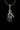 Silver Mystic Hand Pendant showing intricate knuckle details with twelve red crystal stones, hanging on a chain.