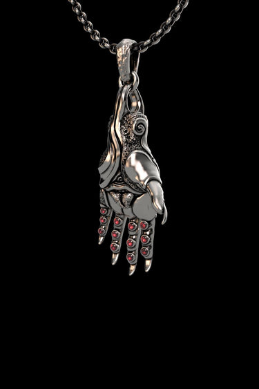 Close-up of mystical hand pendant displaying intricate textures and ornate finger details in sterling silver