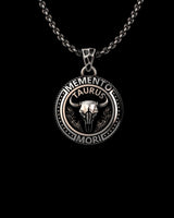 Silver Taurus Pendant with 'Memento Mori' inscription and a bull skull. Handcrafted from 925 sterling silver with an oxidized finish.