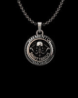 Silver Sagittarius Skull Pendant featuring a central skull, archer's bow, and Memento Mori inscription on an oxidized chain.