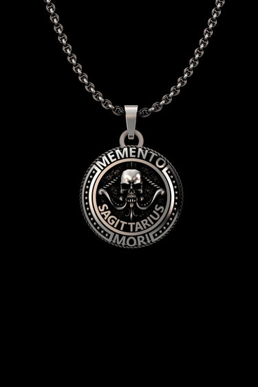 Silver Sagittarius Skull Pendant featuring a central skull, archer's bow, and Memento Mori inscription on an oxidized chain.
